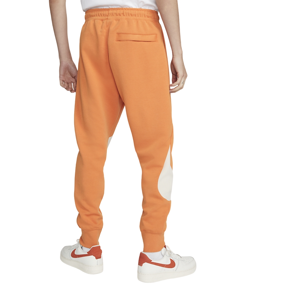 Nike Pantaloni Sportswear Arancioni con swoosh grande